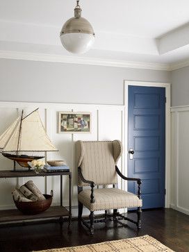 paneling and blue door entry