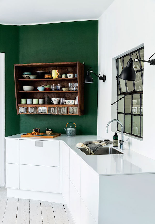 green accent wall white kitchen